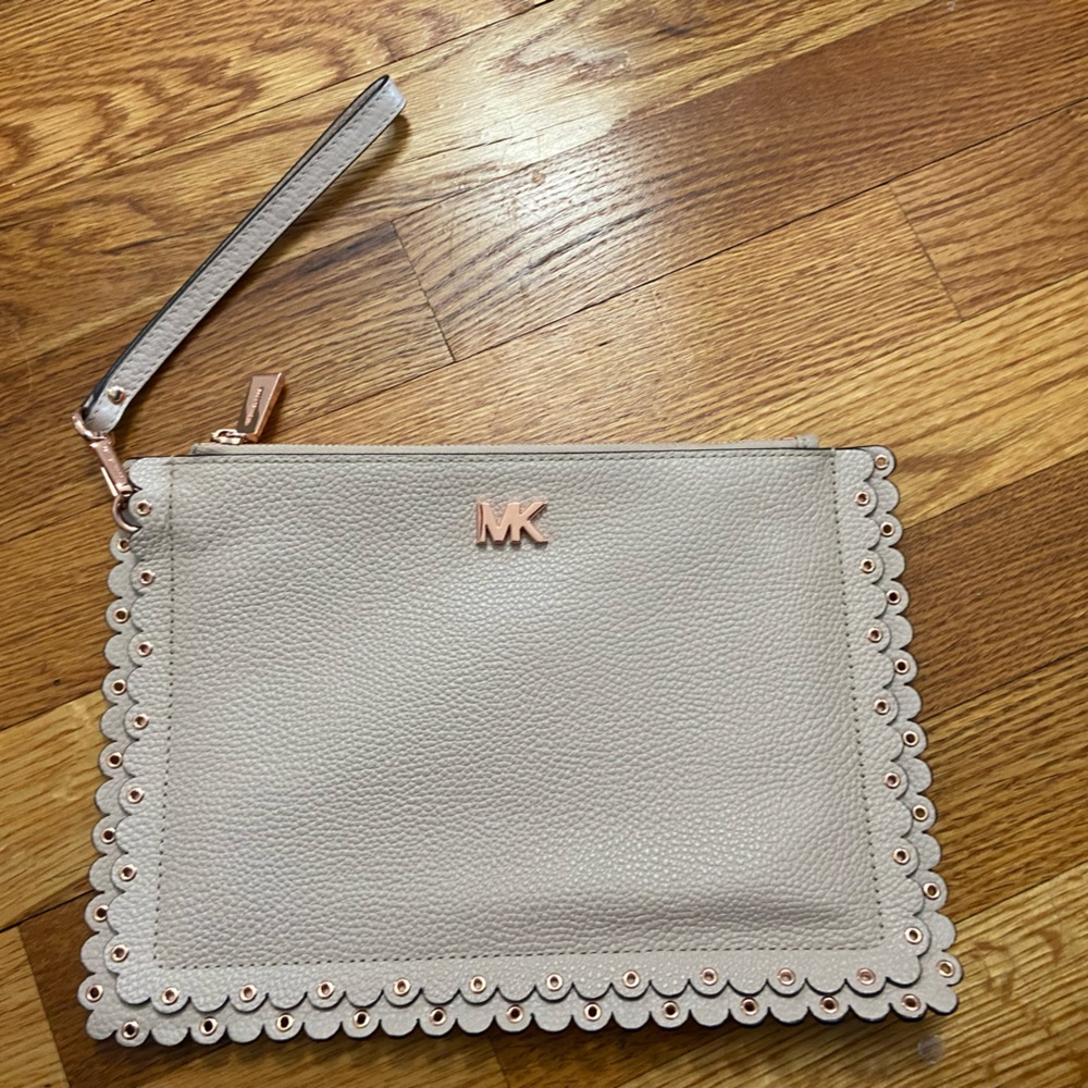 Michael Kors clutch. Light pink with scalloped edges. Rose gold details.